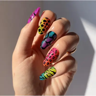 Lisa frank-inspired glittery mismatch animal print nail art