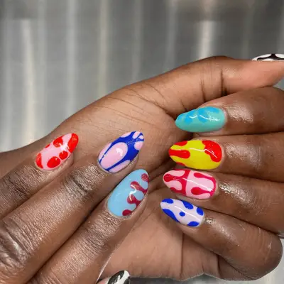 groovy multicolored nail art on short almond-shaped nails