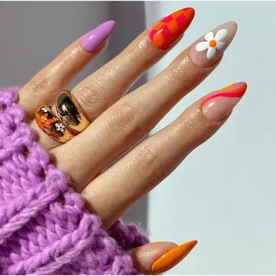 mismatch checkered flower and swirl pattern nail art on long almond-shaped nails