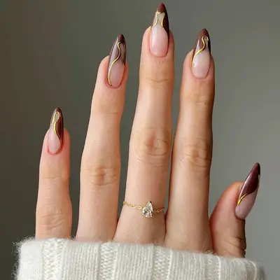 Brown and gold french tip nails
