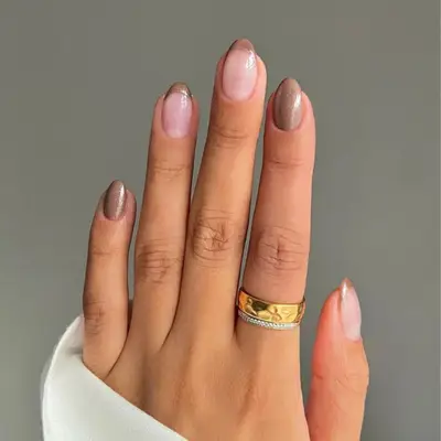 Brown French tip manicure with two solid brown accent nails