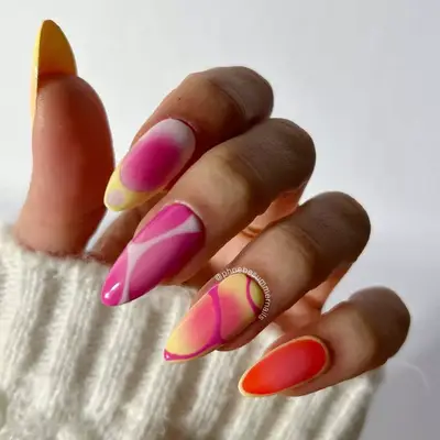 Aura nails with pink and yellow polish