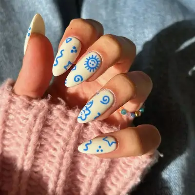 Almond nails with hand-drawn nail art 