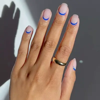 Blue negative space french manicure