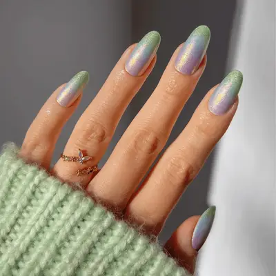 Purple, blue, and green ombre nails.