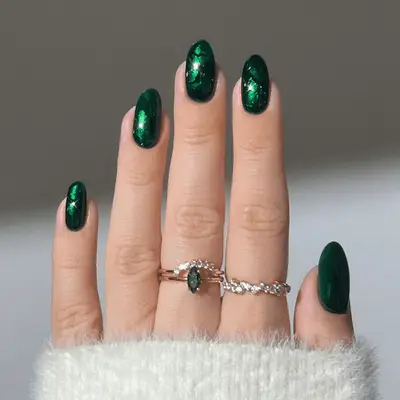 Emerald stained-glass effect nails. 