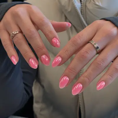 Close up of pink chrome nails.