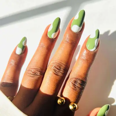 Sage green swirls and white manicure.