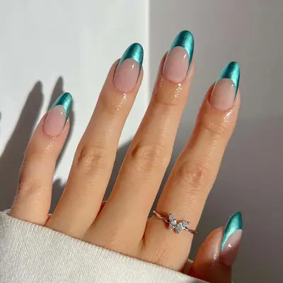 a metallic turquoise french manicure