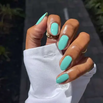 a solid turquoise manicure