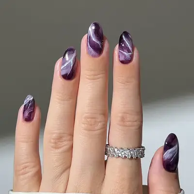an amethyst marbled manicure