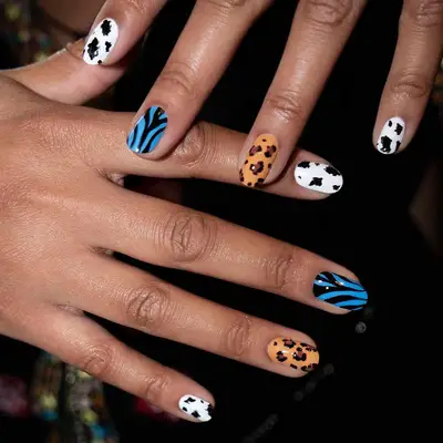 mismatched animal print manicure