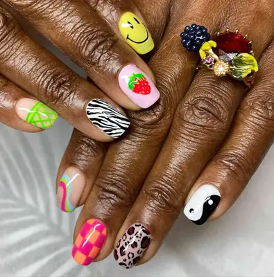 mismatched manicure with cheetah accent nails