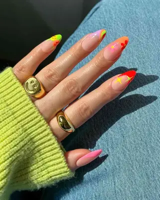 a mismatched manicure with groovy motifs