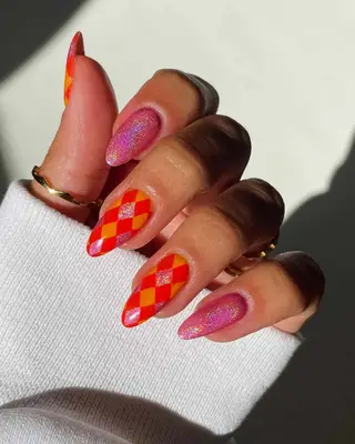 a manicure with argylle print and holo pink nails