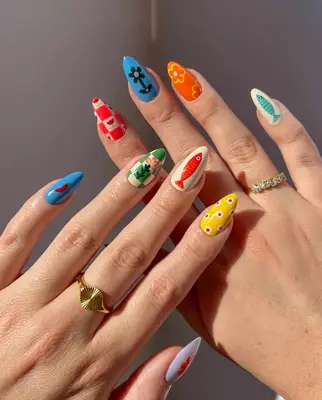 a mismatched manicure with coastal fishing village vibes