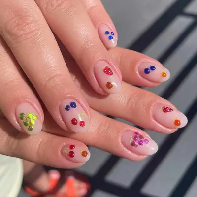 nude short nails with abstract fruit designs