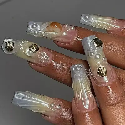 beach nails with gold seashells and pearls