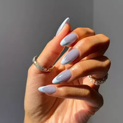 a blue jelly on blue satin french manicure