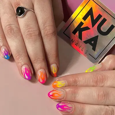 negative space nails with colorful neon flames 