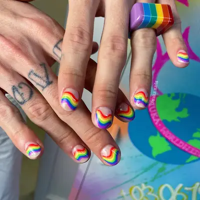 wavy rainbow nail art on short natural nails