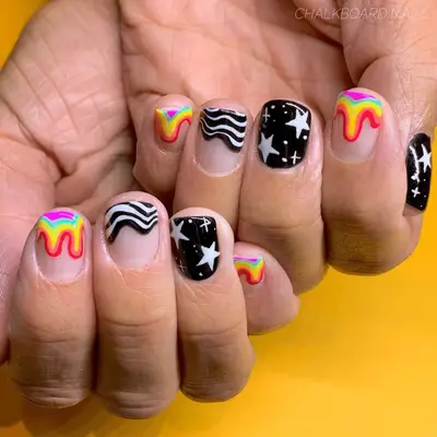 neon trippy nails and black and white nails