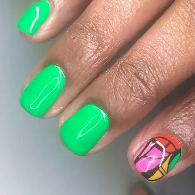 neon green nails with multi-colored abstract accent nail