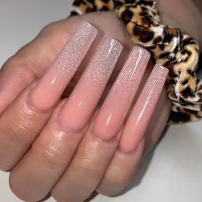 Long silver glitter to peach ombre acrylic manicure
