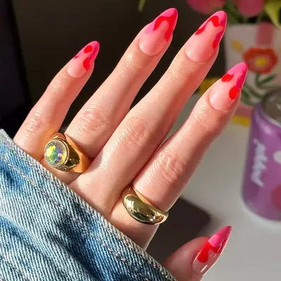 Pink and red drip French manicure on long almond nails