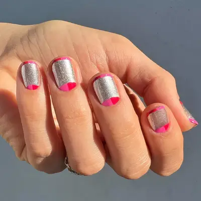 Short nails with silver, red, and hot pink abstract design