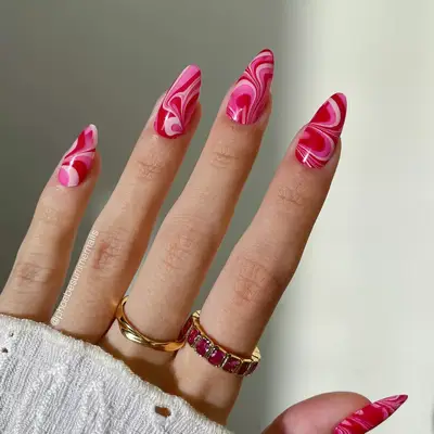 Shades of pink and red swirly tie-dye design