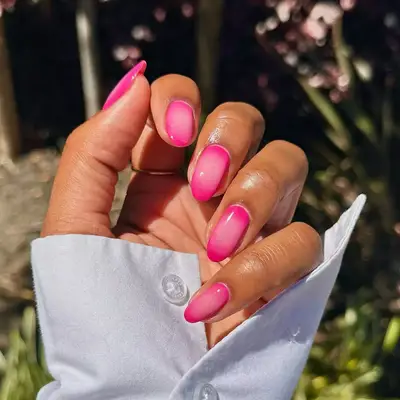 Pink aura nails with light pink in the center and hot pink outside