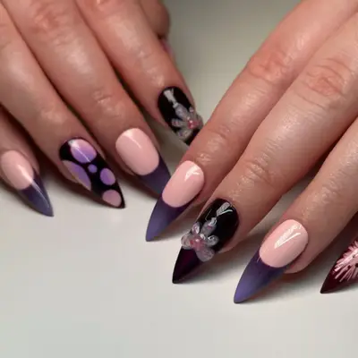 Purple mix-and-match manicure with 3D detail.