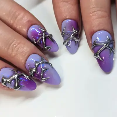 Purple aura nails with 3D silver thorns.