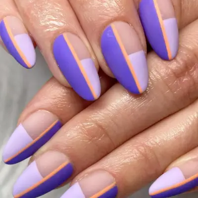 Geometric nail design with two shades of purple and a thin orange line.