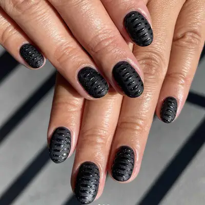 Black matte nails with texture designs