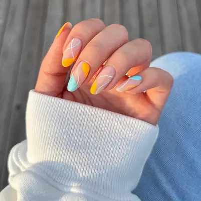 Floral almond nails in pink and orange gradient