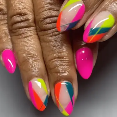 Green and gold almond nails with subtle 3D gold design