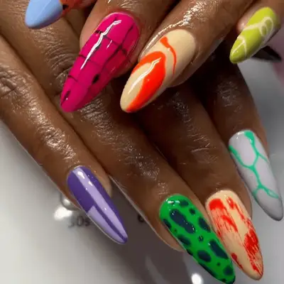 Blue French almond nails with sheer glitter base and opaque tip