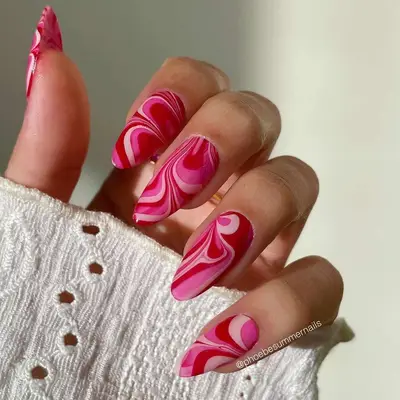 Pink reverse French almond manicure