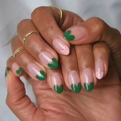 Green and pink heart French tip manicure in almond shape