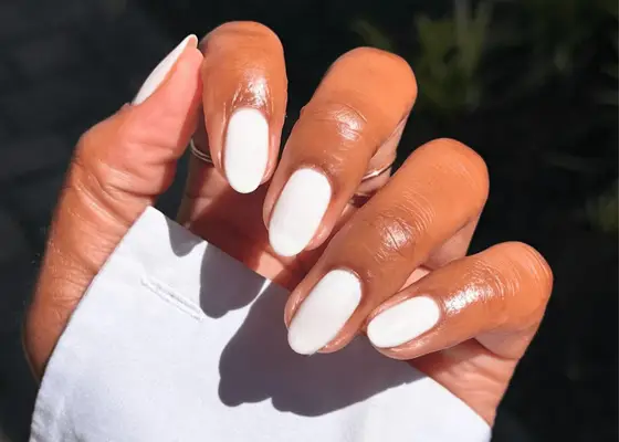 close up of white dip powder manicure