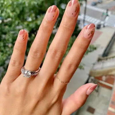 Neutral abstract nail design with negative space