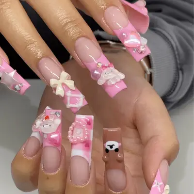Pink french nails with cute 3D embellishments
