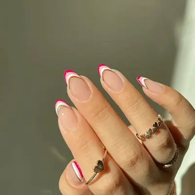 Multi-colored French tips with gold, pink, and white