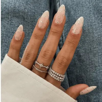 nude nails with rhinestones on each nail