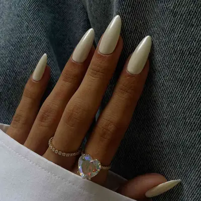 vanilla polish topped with chrome on almond nails
