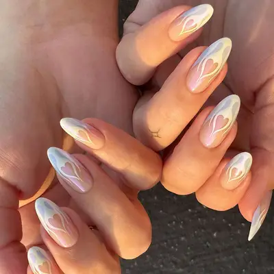 Chrome French manicure topped with heart shaped flame art 