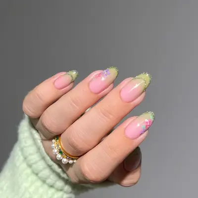 A sheer ombre yellow negative space French manicure