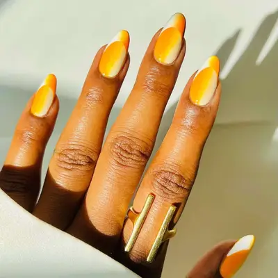 A yellow fade illusion French manicure 